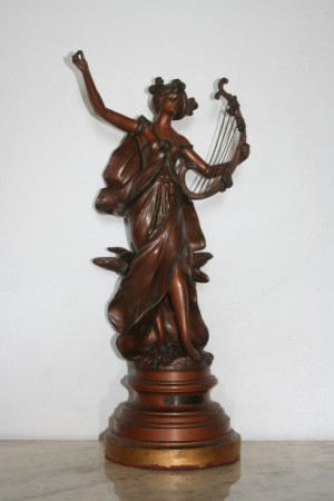 Woman playing the harp sculpture